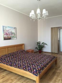 The apartment is located across the street from the park, th