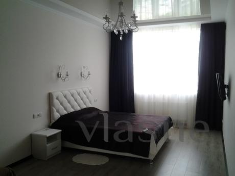 The apartment is overlooking the sea in light tones. The hou