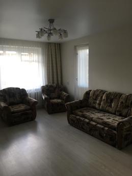 The apartment is in the center of the city, in the area of t