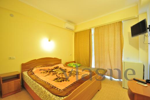 The modern four-storey boarding house offers cozy rooms, loc