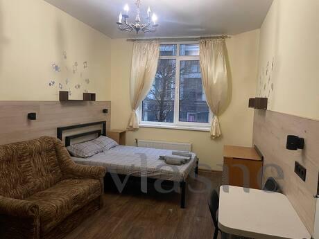 There is a large room with a nice bathroom and a kitchen are