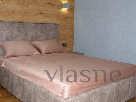 The apartment is in a modern style after repair. It is locat